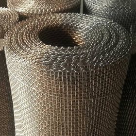 Four rolls of FeCrAl woven wire meshes with wrapped edge.