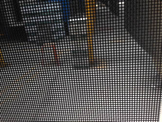 A corner of a crime safe mesh.