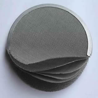 A piece of filter disc with six layers on the white background.