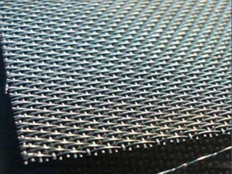A piece of twill weave nickel woven wire mesh on the black background.