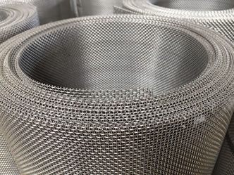 A roll of stainless steel mesh screen with plain weave.