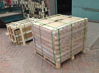 Two pallets of titanium woven wire meshes on the ground.